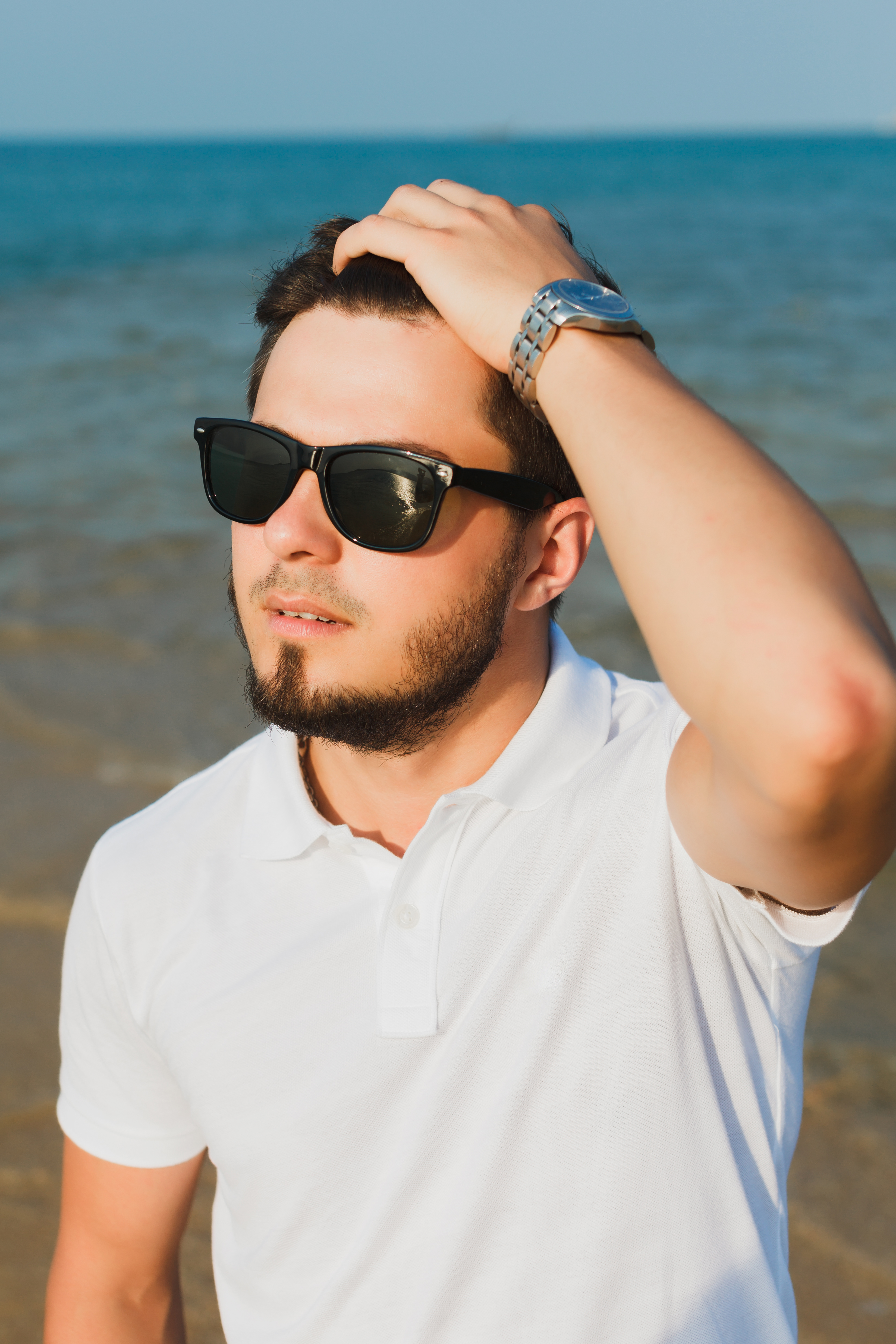 Person enjoying outdoors with UV sunglasses